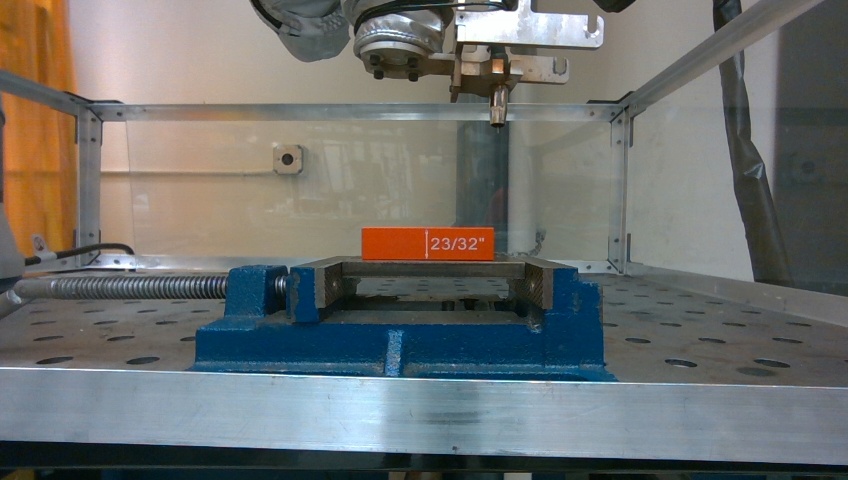 Robot tool and clamped reference object in the experimental setup.